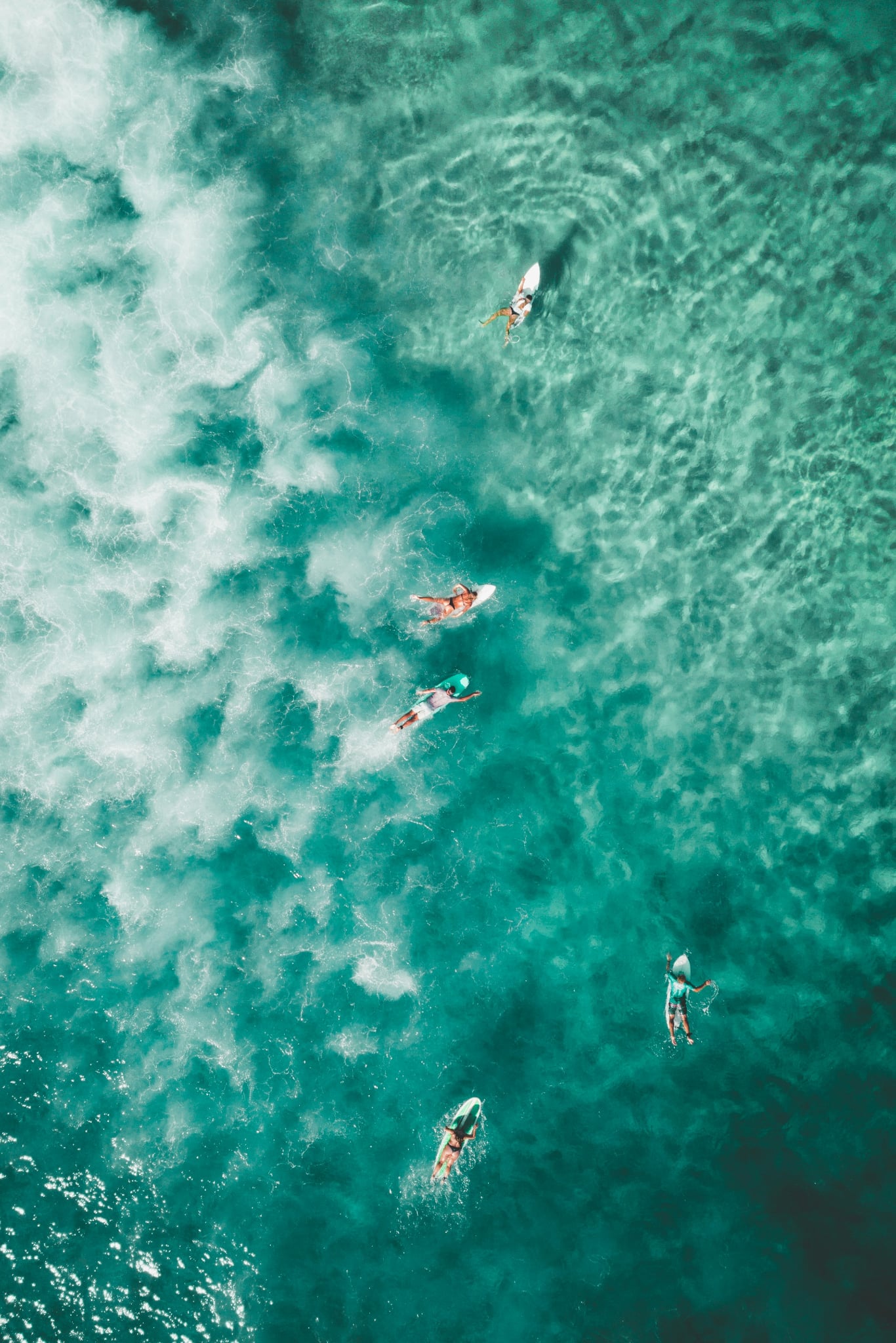 Aerial view of surfers in the ocean